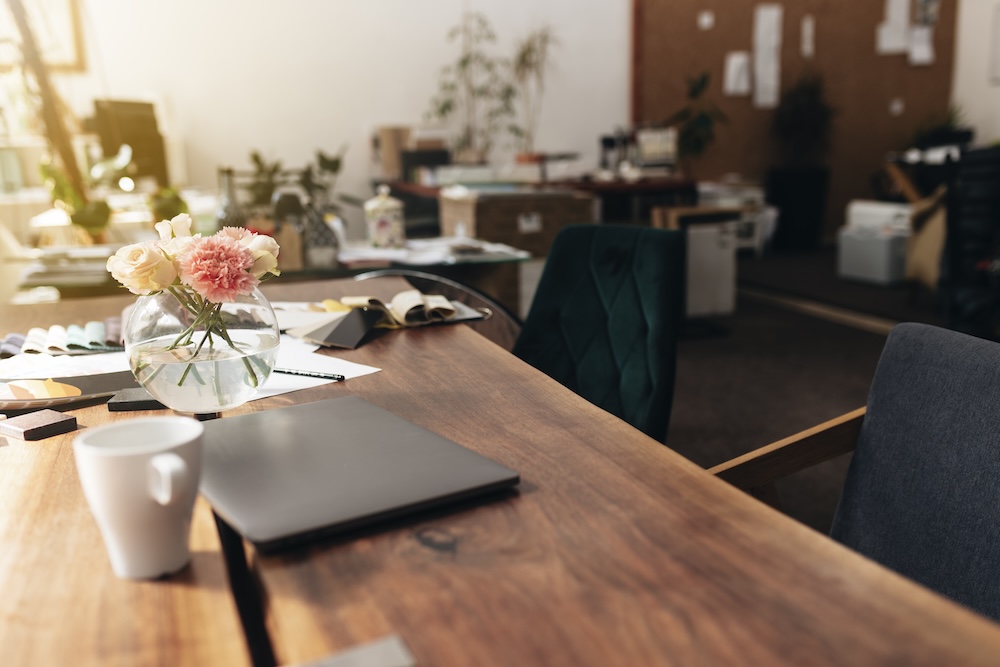 Premium office leasing environment featuring a modern conference table, comfortable seating, and upscale office aesthetics