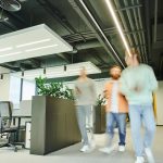 Business space for rent featuring a modern open office with collaborative workstations, contemporary design, and natural light