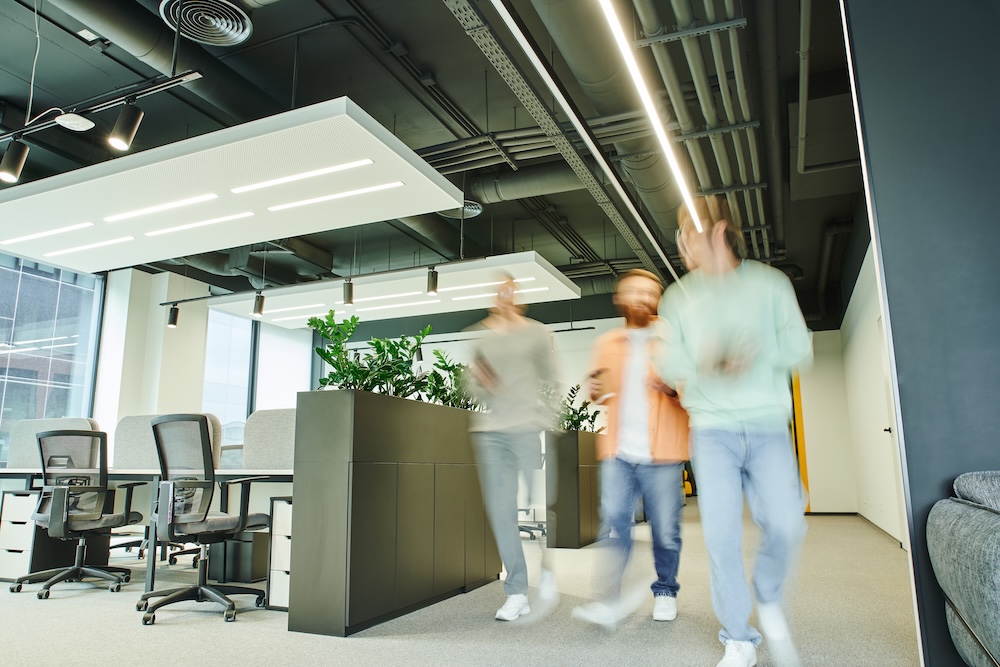 Business space for rent featuring a modern open office with collaborative workstations, contemporary design, and natural light