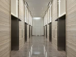 elevator lobby with multiple elevators along the walls