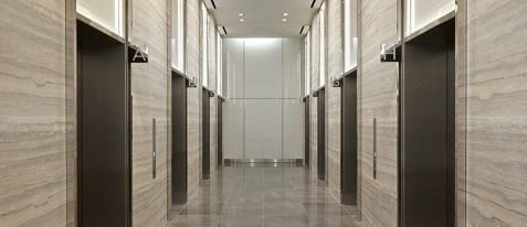 elevator lobby with multiple elevators along the walls