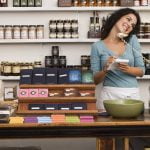Woman taking orders on telephone in shop Woman taking orders on telephone in shop