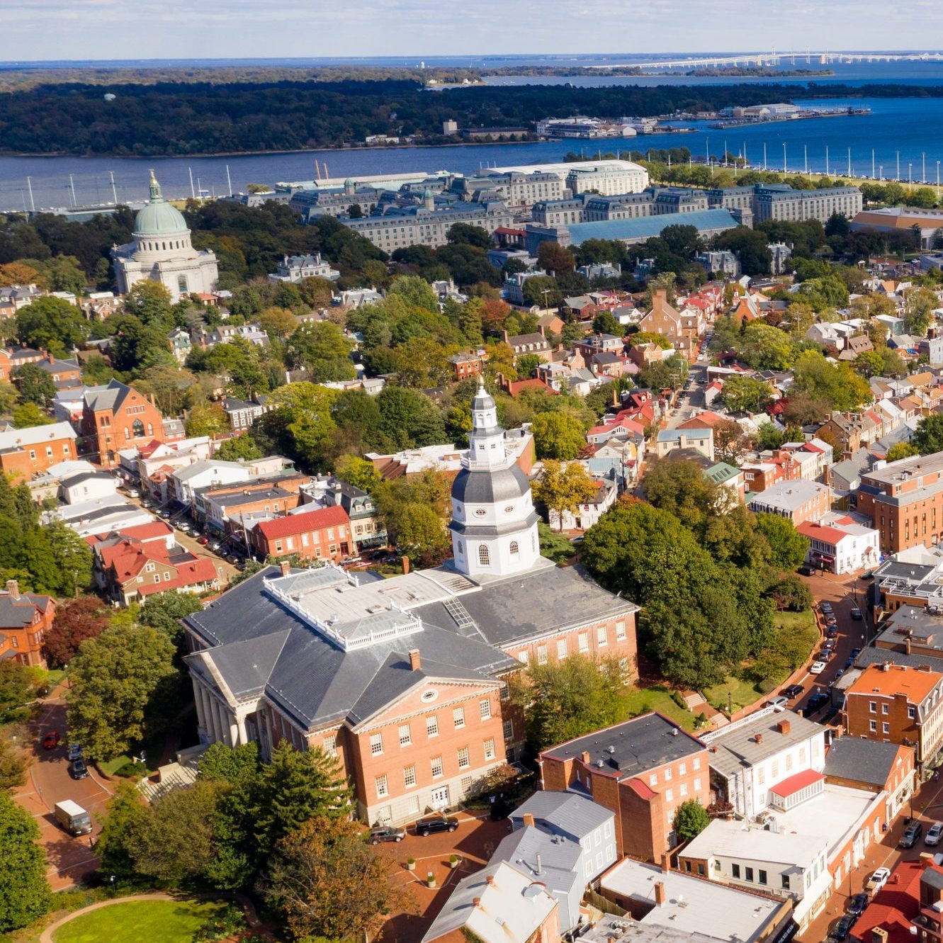 Aerial Panoramic View Annapolis Maryland State House Capital City aerial; cityscape; place; landmark; md; street; scene; annapolis; architecture; historic; sunset; location; capitol; chesapeake; town; small; america; downtown; usa; historical; city; maryland; american; skyline; capital; rooftop; united; buildings; tower; roof; states; state; house; arundel; statehouse; chapel; townscape; cathedral; building; government; college; university; naval; school; dome; academy; bridge; harbor; eastport bridge;